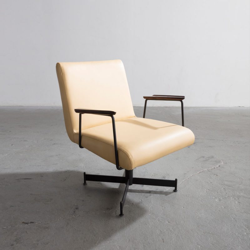Lounge chair with pale yellow leather upholstery