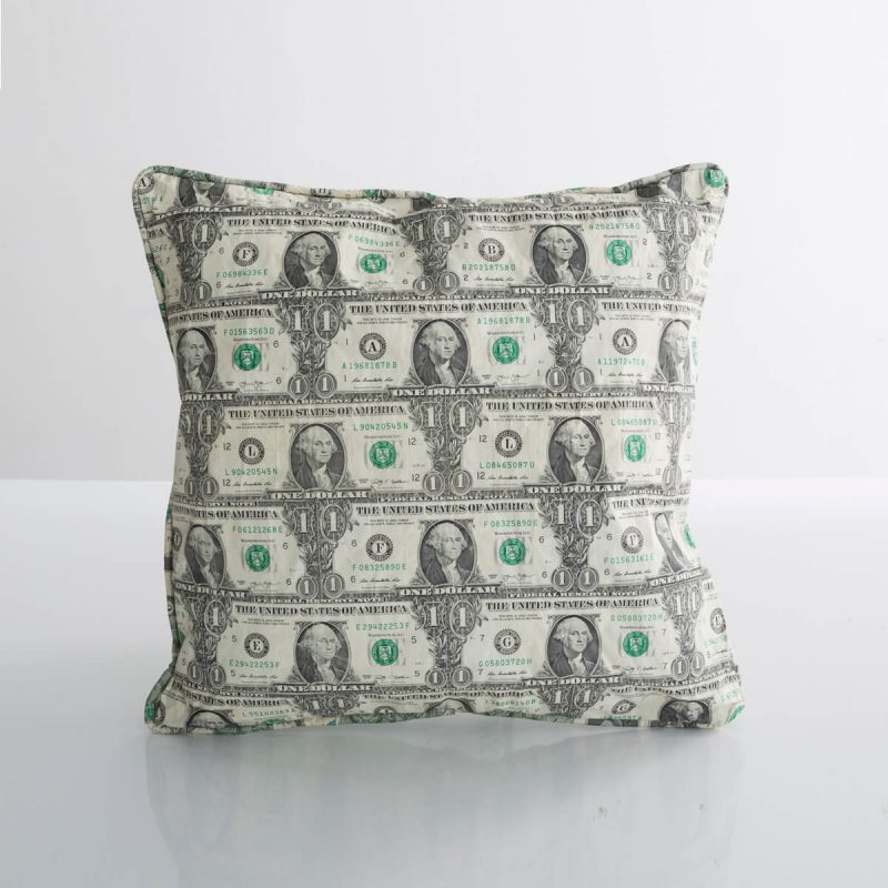 Pillow in cut, pieced, and stitched one-dollar bills.